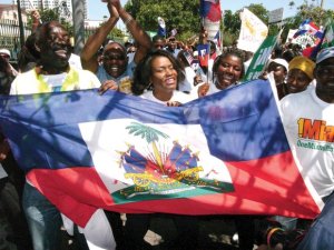 A crowd of South Florida Haitians protest for improved immigration policy for their loved ones. COURTESY OF FANM