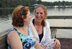 Kathleen and Tricia Russell reminisce on more than 30 years of marriage on a pier at the Marywood Retreat Center in Jacksonville Friday, July 17. Less than a week later, Tricia traveled to Boston for facial feminization surgery, which was a huge and irreversible milestone in her personal journey as a transgender woman.